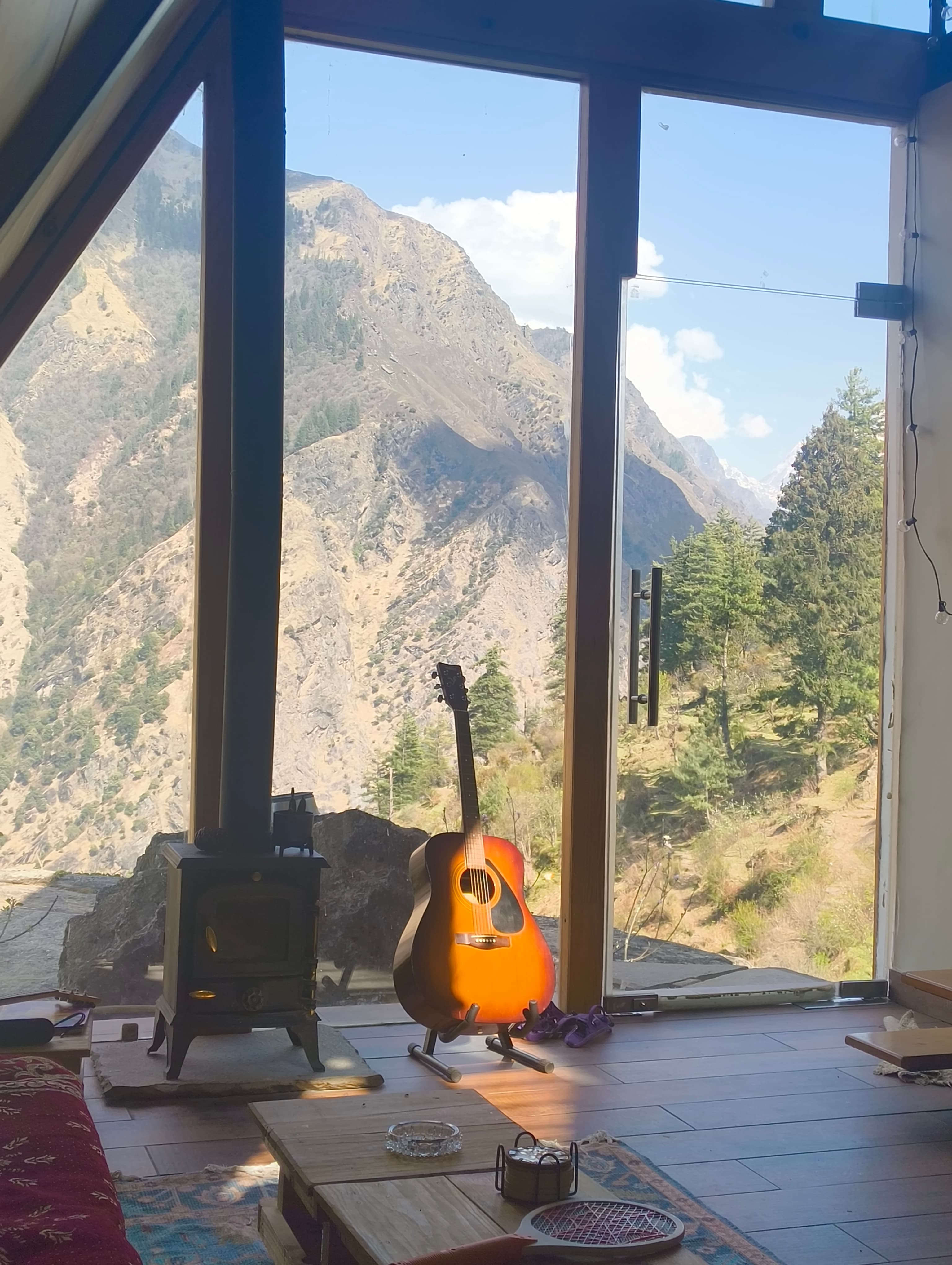 Guitar, woodstove & valley light in Sky View